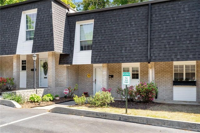 5180 Chemin De Vie, Atlanta, GA 30342 - multi unit property with brick siding, mansard roof, and a shingled roof