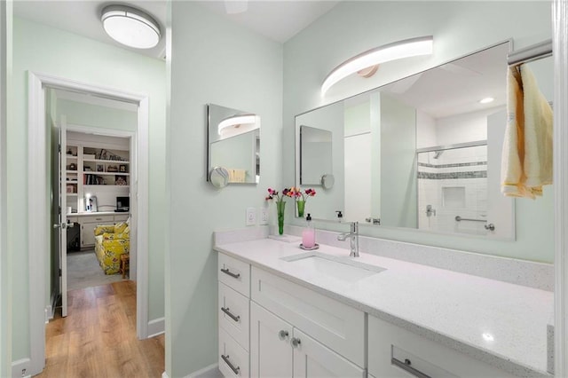 5180 Chemin De Vie, Atlanta, GA 30342 - full bathroom featuring a tile shower, wood finished floors, and vanity