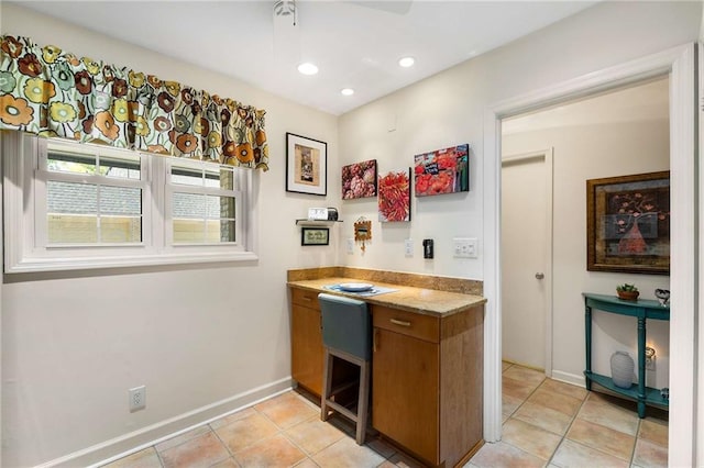 5180 Chemin De Vie, Atlanta, GA 30342 - kitchen with brown cabinets, baseboards, light tile patterned floors, light countertops, and recessed lighting