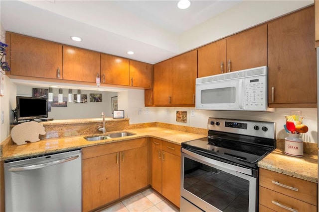 5180 Chemin De Vie, Atlanta, GA 30342 - kitchen with stainless steel appliances, a sink, light stone countertops, recessed lighting, and light tile patterned floors