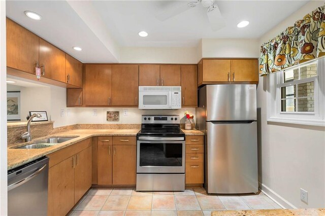5180 Chemin De Vie, Atlanta, GA 30342 - kitchen featuring appliances with stainless steel finishes, a sink, ceiling fan, brown cabinets, and recessed lighting