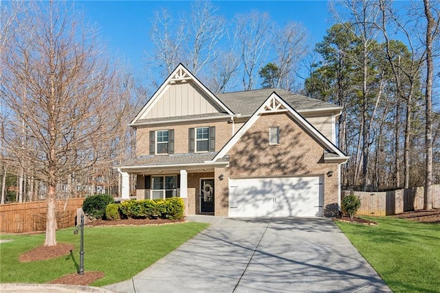 craftsman-style home with a garage and a front lawn