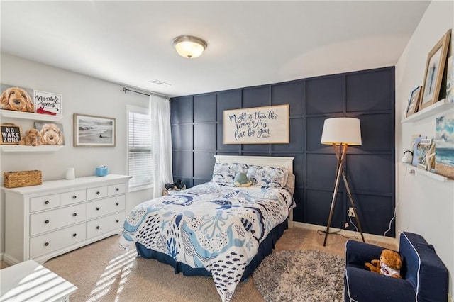 bedroom featuring light colored carpet