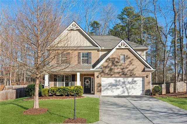 craftsman inspired home featuring a garage and a front lawn