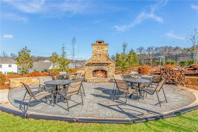 view of patio / terrace with an outdoor stone fireplace