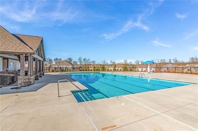 view of swimming pool featuring a patio area