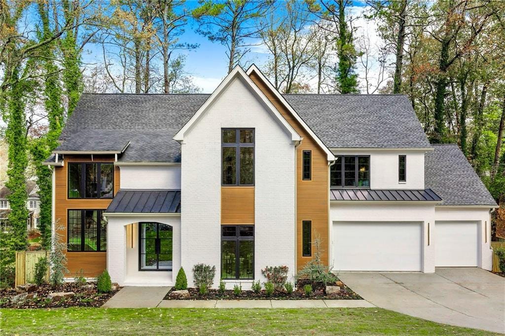 modern farmhouse featuring a garage