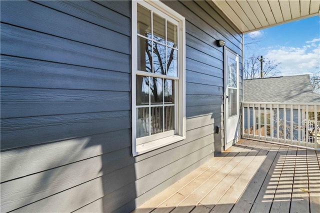 wooden deck featuring a garage