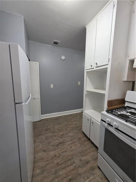 2802 3rd Ave SW, Atlanta, GA 30315 - kitchen with white appliances, white cabinetry, dark wood-type flooring, and open shelves
