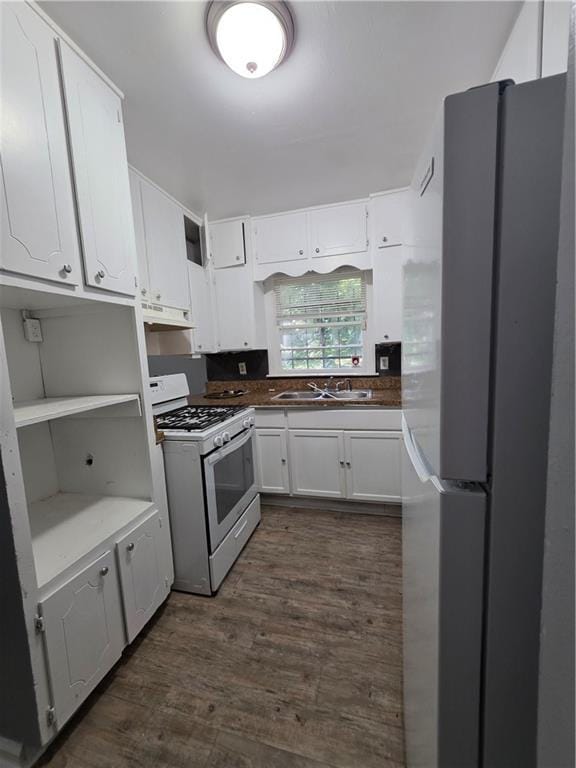 2802 3rd Ave SW, Atlanta, GA 30315 - kitchen featuring white appliances, dark wood finished floors, white cabinetry, under cabinet range hood, and open shelves