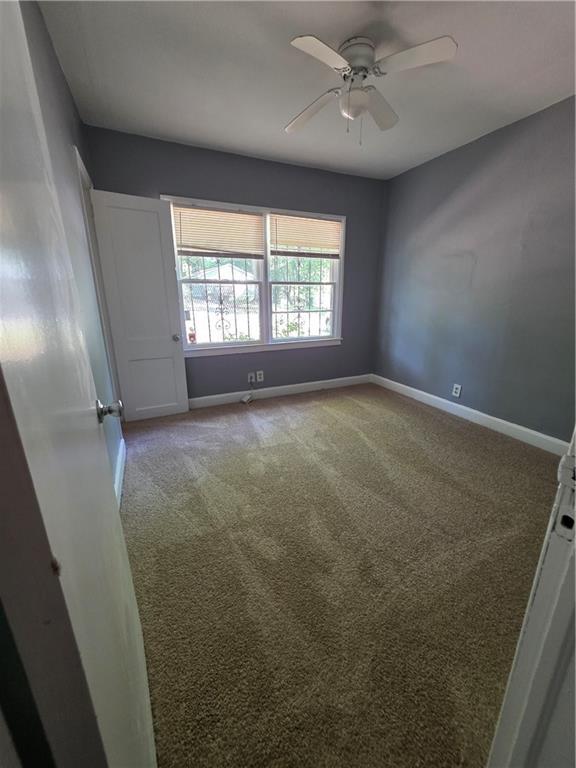 2802 3rd Ave SW, Atlanta, GA 30315 - carpeted spare room featuring baseboards and a ceiling fan