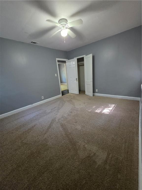 2802 3rd Ave SW, Atlanta, GA 30315 - unfurnished bedroom with light carpet, a closet, and a ceiling fan