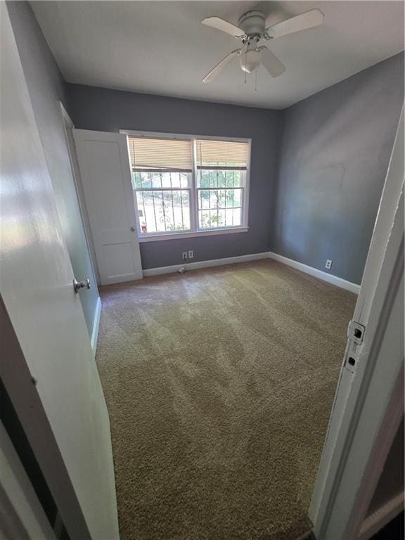 2802 3rd Ave SW, Atlanta, GA 30315 - carpeted spare room with baseboards and ceiling fan