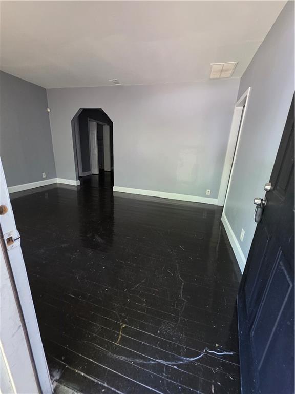 2802 3rd Ave SW, Atlanta, GA 30315 - empty room with hardwood / wood-style floors and arched walkways