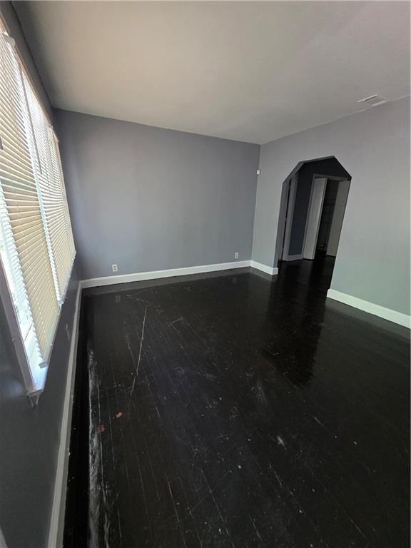 2802 3rd Ave SW, Atlanta, GA 30315 - spare room with arched walkways and hardwood / wood-style flooring