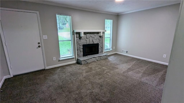 3900 Ferncliff Rd, Snellville, GA 30039 - unfurnished living room featuring ornamental molding, dark carpet, and a stone fireplace