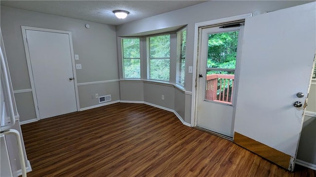 3900 Ferncliff Rd, Snellville, GA 30039 - entryway featuring wood finished floors and a textured ceiling