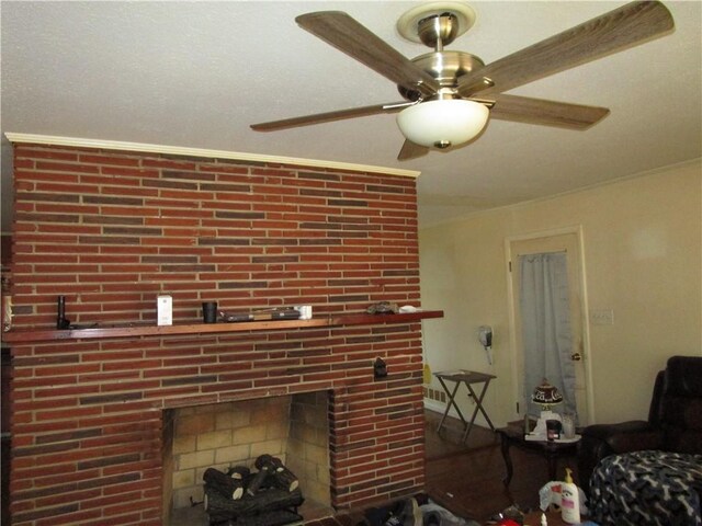 unfurnished living room featuring a fireplace, ceiling fan, and crown molding