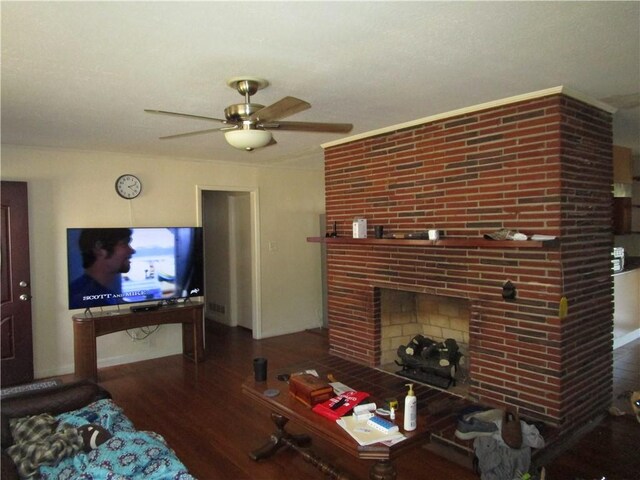 living room with a fireplace, ceiling fan, and hardwood / wood-style floors