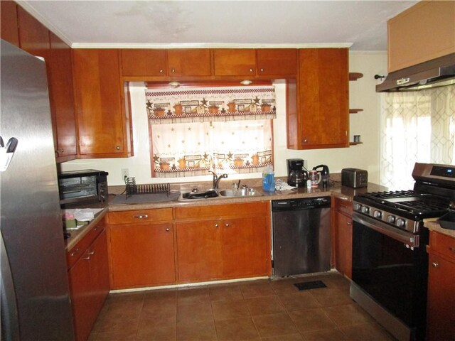 kitchen with sink, stainless steel appliances, dark tile patterned floors, crown molding, and extractor fan