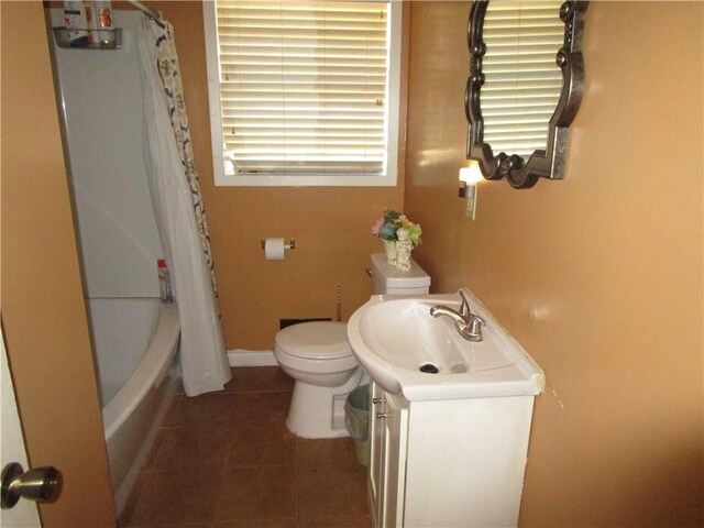 full bathroom featuring tile patterned flooring, vanity, toilet, and shower / tub combo