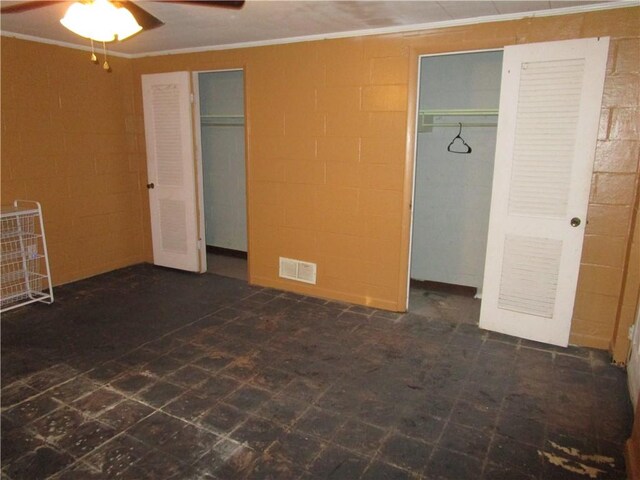 unfurnished bedroom with ceiling fan and ornamental molding