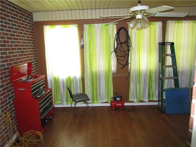 miscellaneous room featuring ceiling fan, dark hardwood / wood-style flooring, and wood ceiling