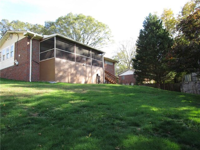 view of yard featuring a sunroom