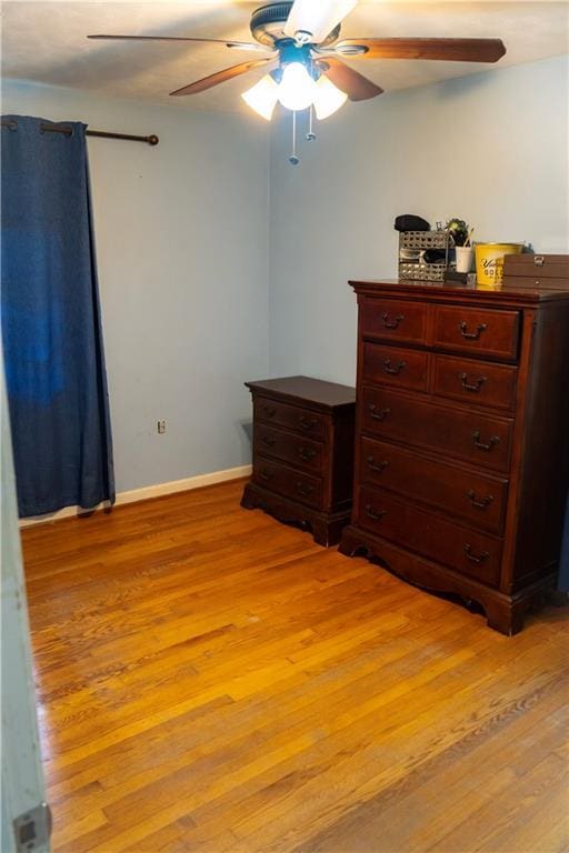 991 Lakemont Dr, Gainesville, GA 30501 - bedroom with light wood finished floors, a ceiling fan, and baseboards