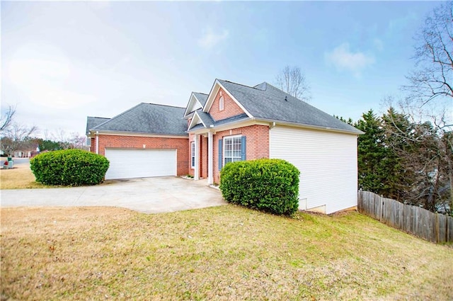 view of front facade featuring a front yard, fence, an attached garage, concrete driveway, and brick siding