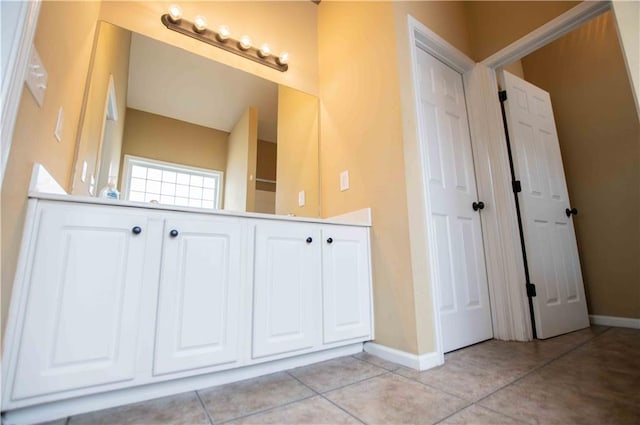 bathroom featuring tile patterned flooring and baseboards