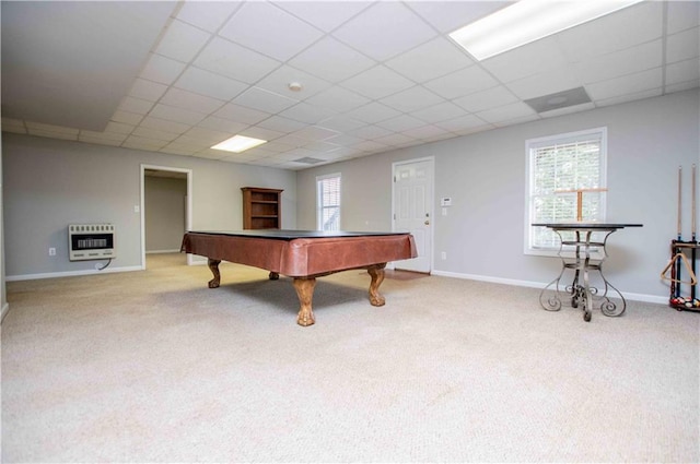 rec room with a drop ceiling, heating unit, and carpet floors