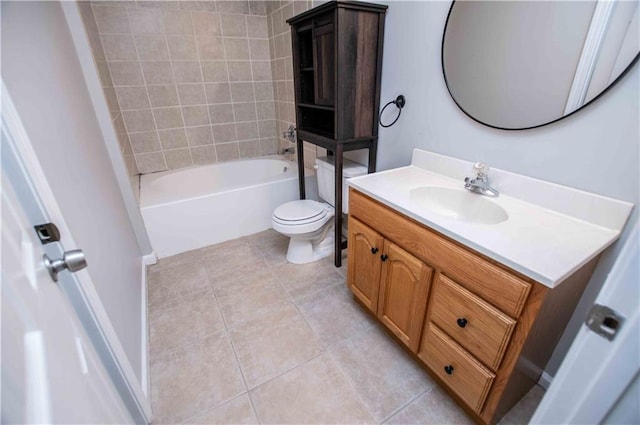 bathroom featuring tile patterned floors, toilet, vanity, and shower / bathing tub combination