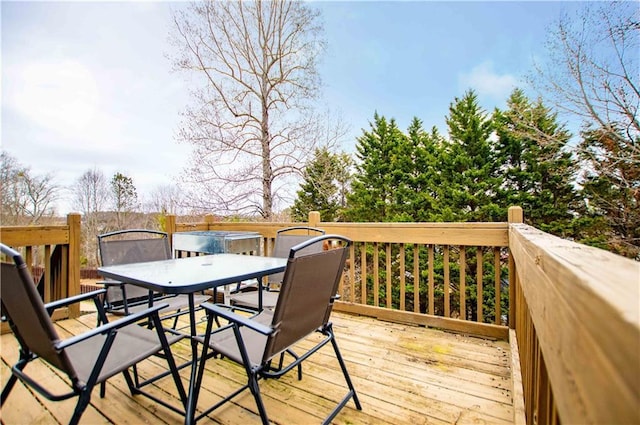 wooden terrace featuring outdoor dining space