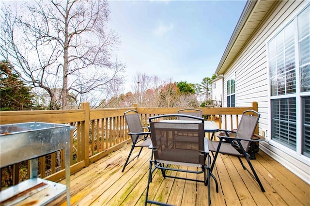 deck featuring outdoor dining area