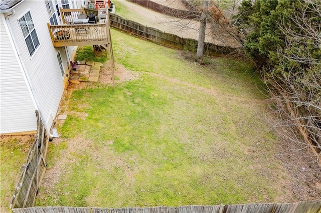 view of yard with a fenced backyard and a deck