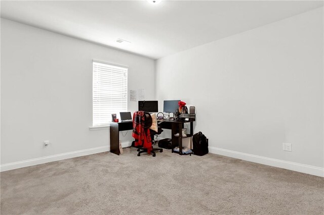 office space with baseboards and carpet