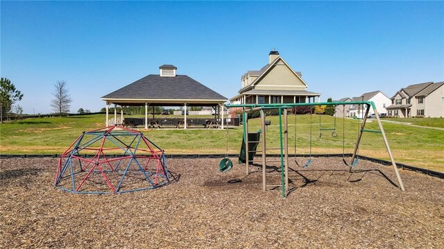 community jungle gym with a lawn and a gazebo