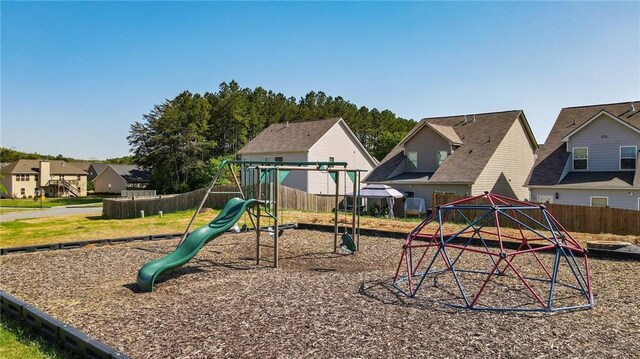 view of play area with fence and a residential view