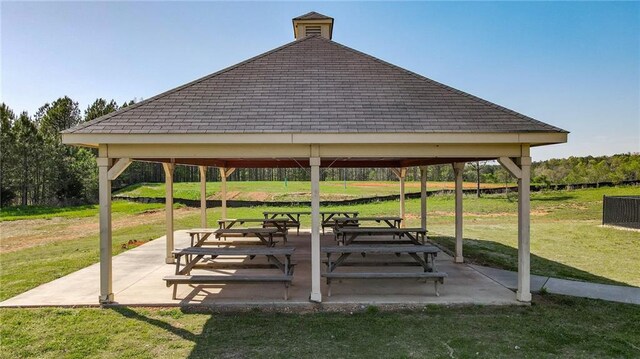 view of home's community with a gazebo, a lawn, and a patio area