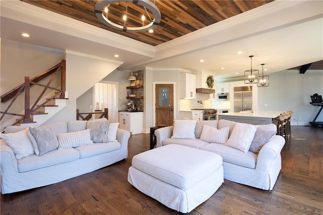 living area featuring wooden ceiling, dark wood-style floors, an inviting chandelier, a tray ceiling, and recessed lighting