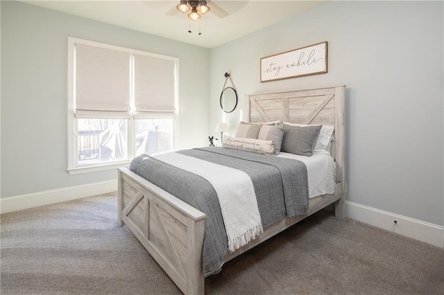 carpeted bedroom with baseboards and a ceiling fan