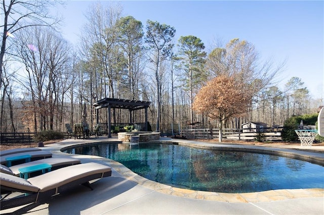 view of pool with a patio area, a pool with connected hot tub, fence, and a pergola