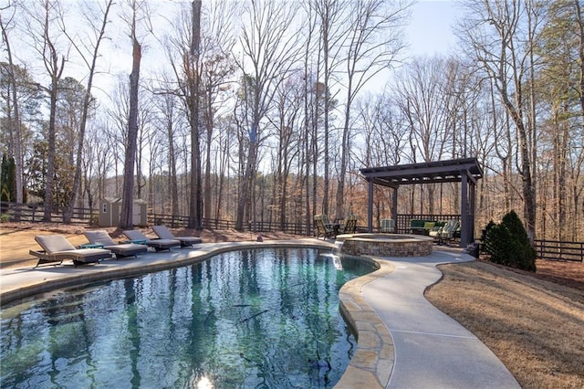 view of swimming pool with a patio, a fenced backyard, and a pool with connected hot tub