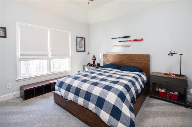 bedroom featuring baseboards and light colored carpet