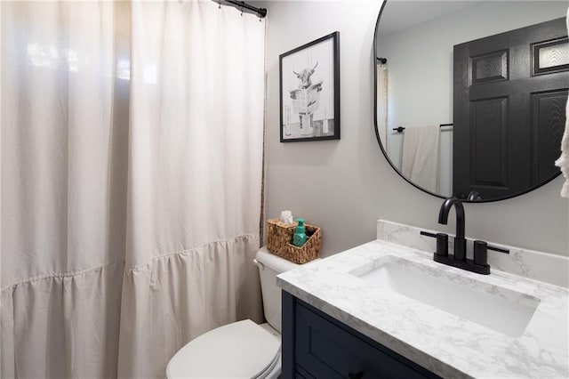 full bath featuring toilet and vanity