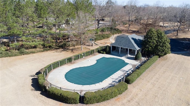 view of pool featuring fence