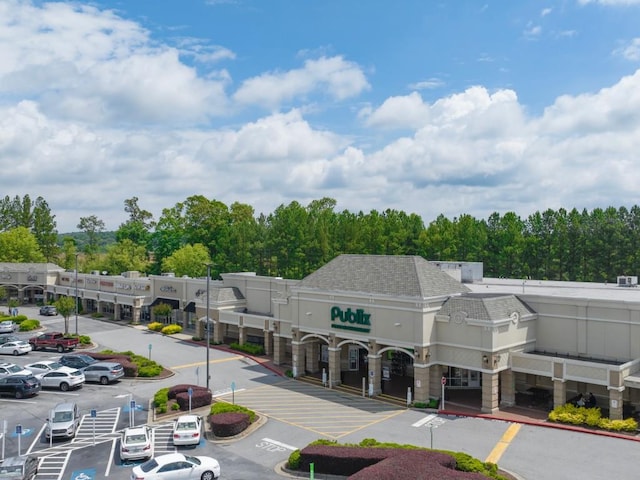 view of property featuring uncovered parking