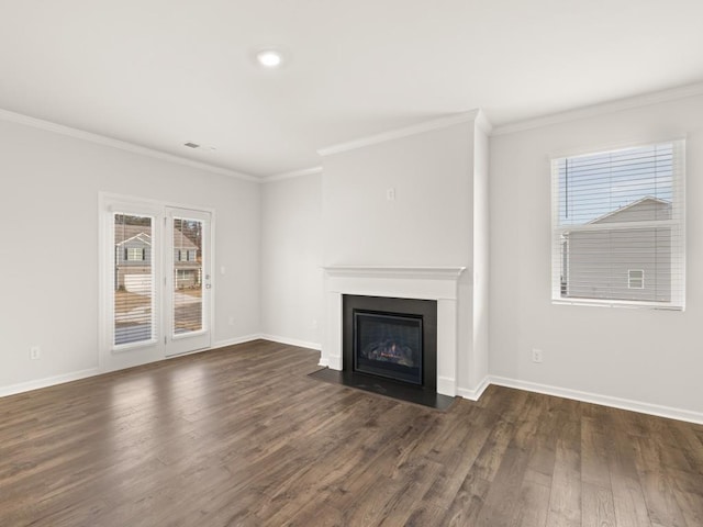 unfurnished living room with ornamental molding, dark wood-type flooring, a fireplace with flush hearth, and visible vents