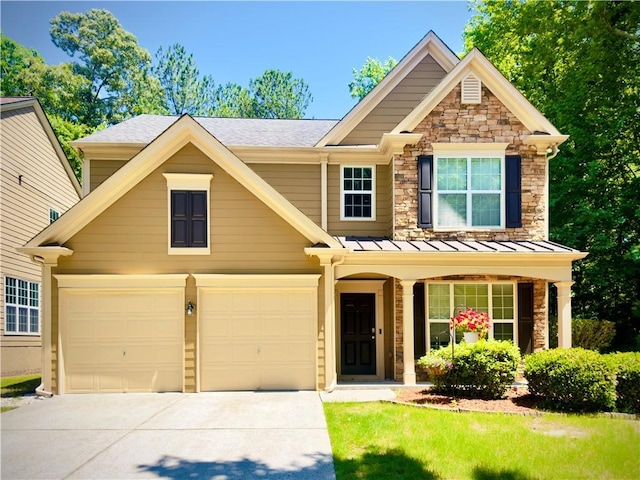 365 Friars Head Dr, Suwanee, GA 30024 - view of front of property with driveway, stone siding, covered porch, a standing seam roof, and roof with shingles
